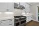 Well-equipped kitchen featuring a stainless steel range and white cabinetry at 1904 French Dr, Raleigh, NC 27612