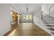 Bright living room with hardwood floors and modern staircase at 1904 French Dr, Raleigh, NC 27612