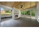Inviting sunroom with wood-paneled ceiling, fireplace, and large windows overlooking the yard at 1904 French Dr, Raleigh, NC 27612