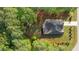 Aerial view of a charming home surrounded by lush greenery and trees with a well-maintained landscape at 2005 Delphi Way, Wake Forest, NC 27587