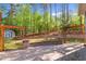 Beautiful backyard with stone patio and tiered landscaping at 2005 Delphi Way, Wake Forest, NC 27587