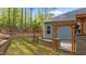Lush backyard with pergola, stone wall, and flowering plants at 2005 Delphi Way, Wake Forest, NC 27587