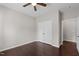Clean bedroom featuring neutral walls, hardwood floors, and a double-door closet for storage at 2005 Delphi Way, Wake Forest, NC 27587