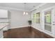 Cozy dining area with large windows and hardwood floors, perfect for casual meals and gatherings at 2005 Delphi Way, Wake Forest, NC 27587