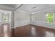 Bright dining room features hardwood floors, wainscoting, and modern light fixture at 2005 Delphi Way, Wake Forest, NC 27587