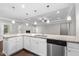 Bright and spacious kitchen featuring an island, granite countertops, stainless steel appliances, and hardwood floors at 2005 Delphi Way, Wake Forest, NC 27587