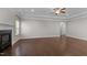 Inviting living room with hardwood floors, a fireplace, and natural light, creating a comfortable and welcoming space at 2005 Delphi Way, Wake Forest, NC 27587