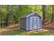 Well-maintained shed surrounded by mature trees at 2005 Delphi Way, Wake Forest, NC 27587