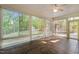 Bright sunroom with tile floors is enclosed with many windows at 2005 Delphi Way, Wake Forest, NC 27587
