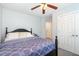 Comfortable bedroom with a ceiling fan, closet, and natural light at 205 Braxcarr St, Holly Springs, NC 27540