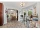 Bright breakfast nook with natural light and an archway leading to the dining area at 205 Braxcarr St, Holly Springs, NC 27540