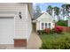 Inviting home featuring a walkway leading to a green front door and a meticulously maintained front yard at 205 Braxcarr St, Holly Springs, NC 27540