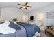 Cozy main bedroom features a ceiling fan and doorway access to the ensuite bath at 205 Braxcarr St, Holly Springs, NC 27540