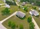 Stunning aerial view of a home with an expansive lawn, mature trees, and a winding driveway at 205 Twin Oaks Dr, Angier, NC 27501