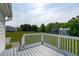 A backyard with a spacious deck overlooking a lush green lawn at 205 Twin Oaks Dr, Angier, NC 27501