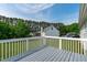 A spacious back deck overlooking a lush green lawn and mature trees at 205 Twin Oaks Dr, Angier, NC 27501