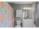 Bathroom featuring ample lighting, a shower, and a toilet at 205 Twin Oaks Dr, Angier, NC 27501