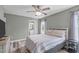 Cozy bedroom featuring soft natural light, ceiling fan, with hardwood floors at 205 Twin Oaks Dr, Angier, NC 27501