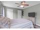 Inviting bedroom with a ceiling fan, hardwood floors, and natural light at 205 Twin Oaks Dr, Angier, NC 27501