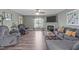 Cozy living room with a ceiling fan, hardwood floors, fireplace and comfortable seating for a relaxing atmosphere at 205 Twin Oaks Dr, Angier, NC 27501