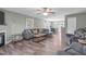 Spacious living room featuring an open layout, hardwood floors, comfortable seating, and natural light at 205 Twin Oaks Dr, Angier, NC 27501
