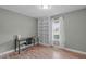 Bright office space with built-in shelving, desk, chair, and ample natural light at 205 Twin Oaks Dr, Angier, NC 27501