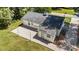 Birds eye view of backyard showing the gravel and the position of the grass and street around the home at 207 N Aiken St, Fuquay Varina, NC 27526