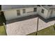 Aerial view of backyard highlighting the gravel area and surrounding grassy yard at 207 N Aiken St, Fuquay Varina, NC 27526