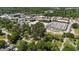 An aerial view of a neighborhood, with mature trees near commercial and residential zones at 207 N Aiken St, Fuquay Varina, NC 27526
