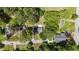 An aerial view showcases the home's location within a lush, tree-filled neighborhood at 207 N Aiken St, Fuquay Varina, NC 27526