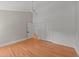 A bright bedroom with hardwood floors and a closet at 207 N Aiken St, Fuquay Varina, NC 27526