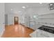 Spacious kitchen with stainless appliances, marble counters, opens to living area at 207 N Aiken St, Fuquay Varina, NC 27526