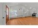 Charming kitchen features white cabinetry, stainless appliances, and hardwood floors at 207 N Aiken St, Fuquay Varina, NC 27526