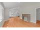 Open-concept living room boasts wood floors, fireplace, and an open layout at 207 N Aiken St, Fuquay Varina, NC 27526