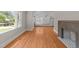 Large living room features a fireplace, hardwood floors and lots of light at 207 N Aiken St, Fuquay Varina, NC 27526