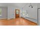 Inviting living room with wood floors, and a charming window seat at 207 N Aiken St, Fuquay Varina, NC 27526