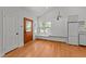 Light-filled living room featuring beautiful wood floors and a cozy window seat at 207 N Aiken St, Fuquay Varina, NC 27526