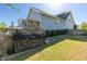 Spacious backyard featuring a stone wood-burning outdoor oven and an outdoor cooking area at 208 Vervain Way, Holly Springs, NC 27540