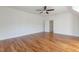 Spacious bedroom featuring hardwood floors and ample closet space at 208 Vervain Way, Holly Springs, NC 27540