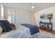 Cozy bedroom featuring a comfortable bed and stylish decor, with a window offering natural light at 208 Vervain Way, Holly Springs, NC 27540