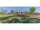 Beautiful exterior of the clubhouse set against a lush green lawn at 208 Vervain Way, Holly Springs, NC 27540