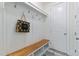 Mud room with hooks, bench, and storage, a practical and stylish entryway feature at 208 Vervain Way, Holly Springs, NC 27540