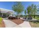 Relaxing outdoor lounge area with a fire pit and seating for cozy evenings at 208 Vervain Way, Holly Springs, NC 27540