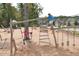 Community playground with various activities at 208 Vervain Way, Holly Springs, NC 27540