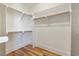 Spacious walk-in closet with ample shelving and storage space, perfect for organizing at 208 Vervain Way, Holly Springs, NC 27540
