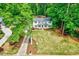 Aerial view of a classic two-story home with a manicured front lawn and mature trees offering curb appeal at 212 Ronaldsby Dr, Cary, NC 27511