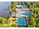 Aerial view of the community tennis and pickle ball courts alongside the lake at 212 Ronaldsby Dr, Cary, NC 27511
