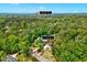 Aerial view of a home's location surrounded by trees and convenient proximity to the McGregor Downs Club House at 212 Ronaldsby Dr, Cary, NC 27511