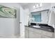 Bright bathroom featuring a granite countertop, decorative vase, and an open doorway to the bedroom at 212 Ronaldsby Dr, Cary, NC 27511