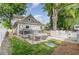 Charming backyard with a cozy patio and a white picket fence at 219 Northwood Cir, Durham, NC 27701